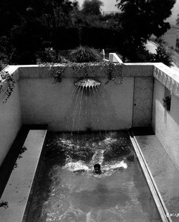 ramon-novarro-in-his-pool.webp