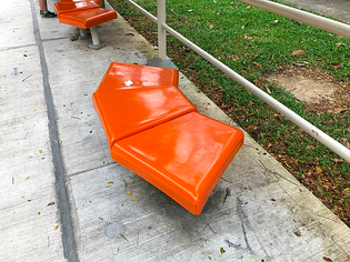 bus stop seating repurposed in a temporary bus shelter